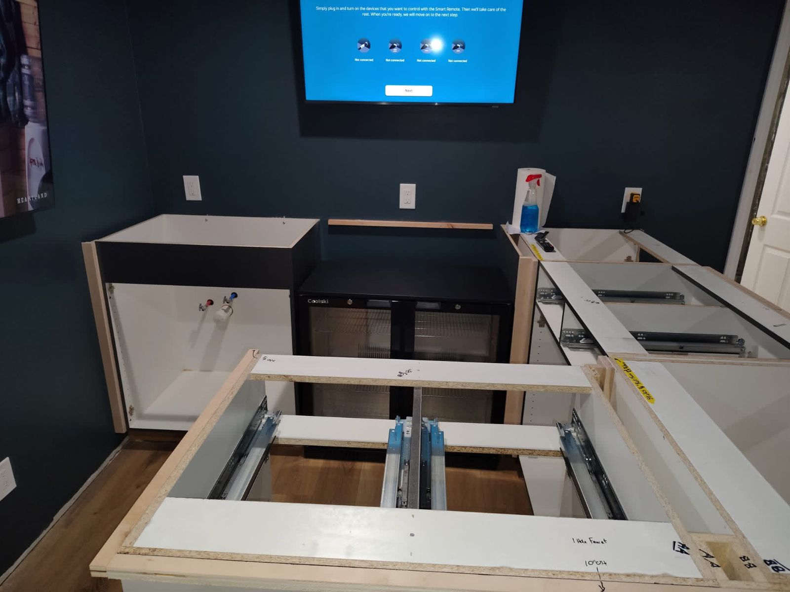 Framing and cabinetry in progress on a CCP Contracting basement project