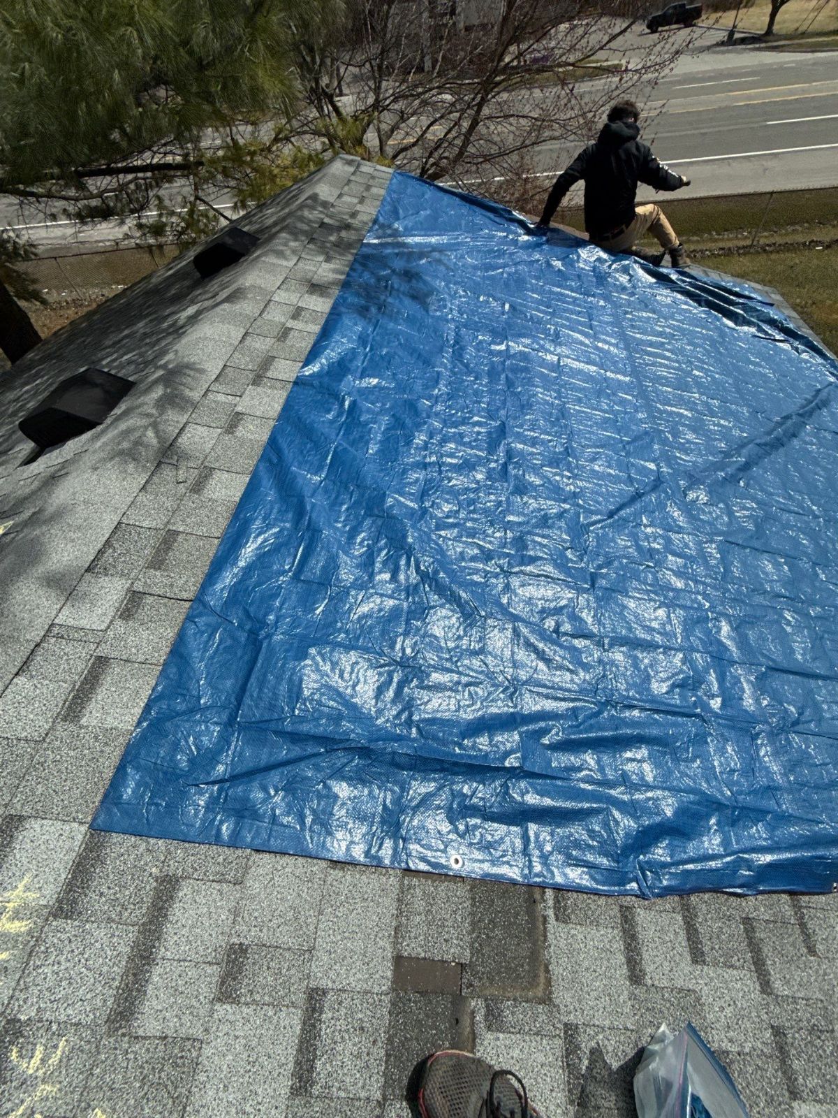 Emergency roof tarp installed by CCP Contracting after storm damage